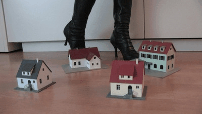 592 - Model railway houses under sexy boots